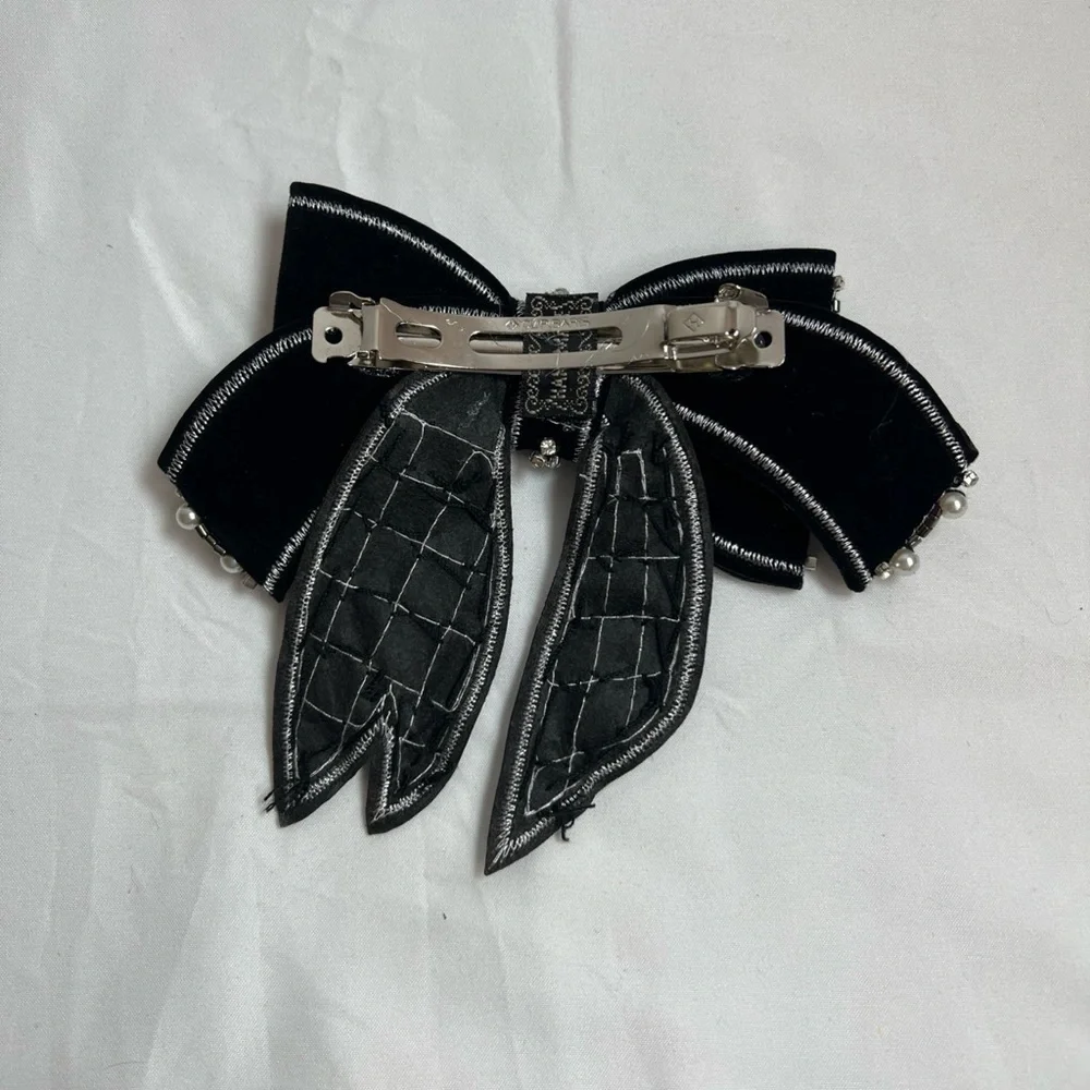Elegant Black and Silver Bow Accessory